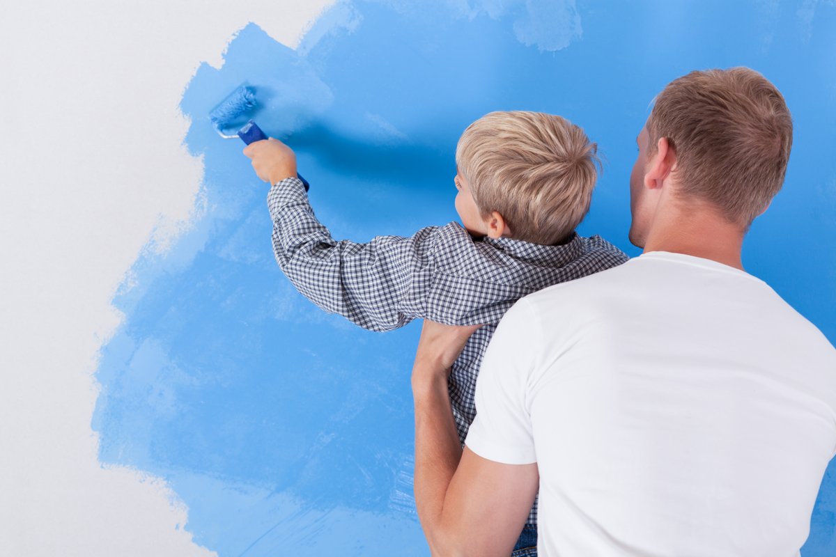 man and child painting